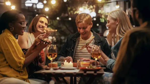 friends on a patio at night
